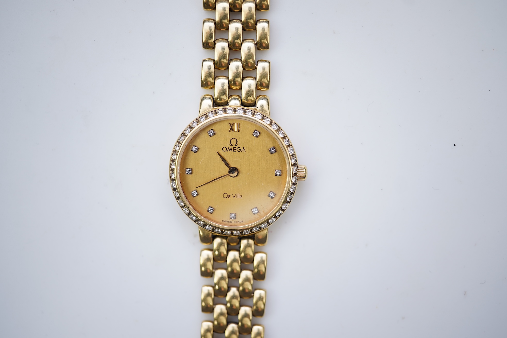Omega, a lady's 18ct gold and diamond 'De Ville' wristwatch
